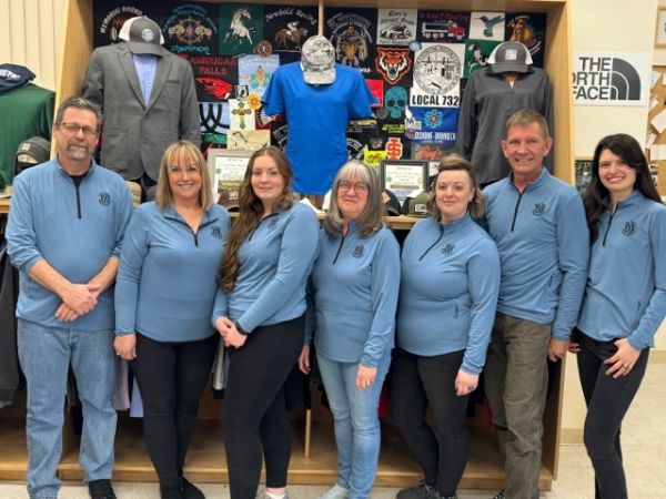Old Town Embroidery storefront and team